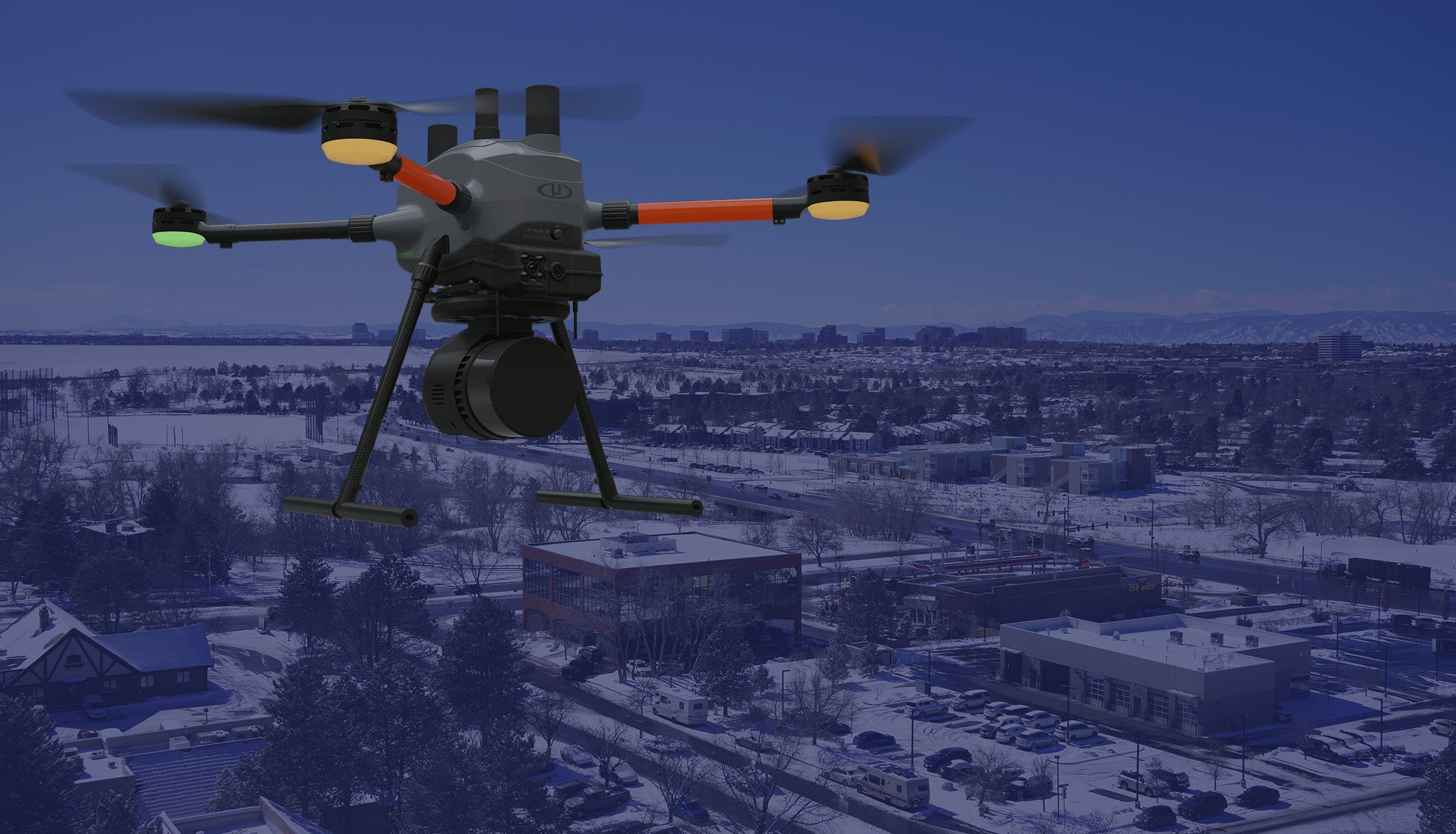 EasyOne from Microdrones flying over Denver cityscape